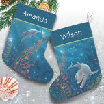 Unique Beach Themed Magical Dolphin Name Small Christmas Stocking<br><div class="desc">Dive into the holiday spirit with enchanting dolphin christmas stockings, adorned with whimsical original watercolor art by Raphaela Wilson that captures the playful spirit of these elegant beach porpoises. Each custom stocking is a canvas of holiday joy, featuring vibrant colours and a charming scene of dolphins decorating under the sea...</div>