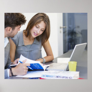 University students using laptop in classroom poster