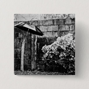 up against the rain 15 cm square badge