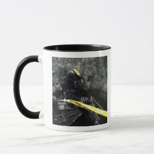 US Navy Diver gets ready to start his dive Mug