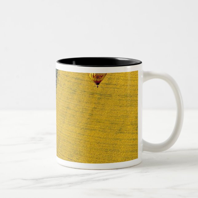 USA, Arizona, Val Vista. Hot-air balloons soar Two-Tone Coffee Mug (Right)