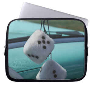 USA, Massachusetts, Gloucester. Fuzzy dice in a Laptop Sleeve