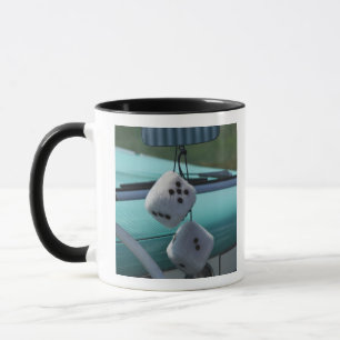 USA, Massachusetts, Gloucester. Fuzzy dice in a Mug