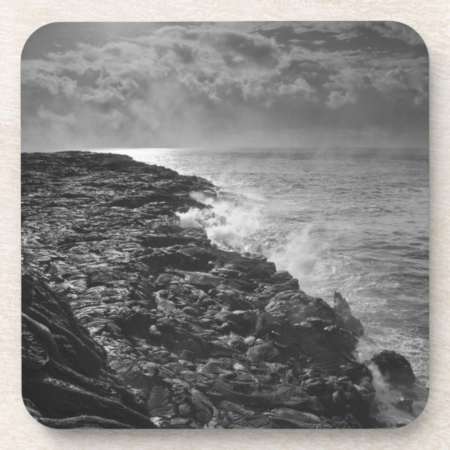 USA. Molten lava flows into the ocean at sunrise Coaster (Front)