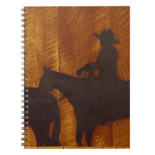 USA, Montana, Boulder River Cowboys on horses Notebook