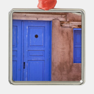 USA, New Mexico, Santa Fe. View of blue door and Metal Tree Decoration