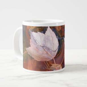 USA, Northeast, Fall leaves in puddle with Large Coffee Mug