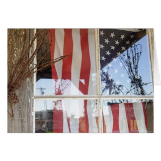 USA, Oregon, Shaniko. Flag in window next to