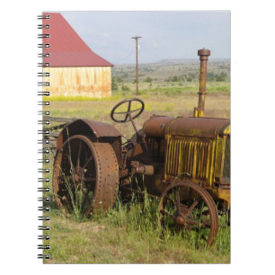 USA, Oregon, Shaniko. Rusty vintage tractor in Notebook