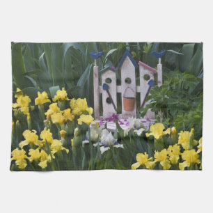 USA, Pennsylvania. Garden irises grow around Tea Towel