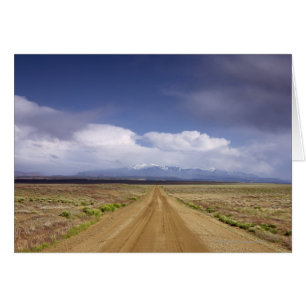 USA, Utah, Dirt road crossing landscape