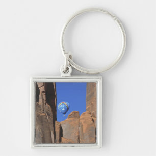 USA, Utah, Monument Valley. A rainbow hot-air Key Ring