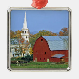 USA, Vermont, Peacham. A red barn and white Metal Tree Decoration