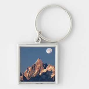USA, Wyoming, Grand Teton NP. A full moon sets Key Ring
