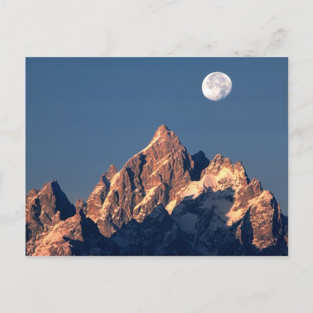 USA, Wyoming, Grand Teton NP. A full moon sets Postcard (Front)