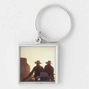 USA, Wyoming, Pine Bluffs. Two men shake Key Ring
