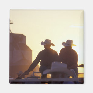 USA, Wyoming, Pine Bluffs. Two men shake Magnet
