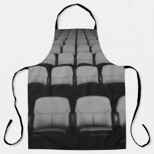 VACANT WHITE AND BLACK THEATER CHAIRS WITH NO PEOP APRON