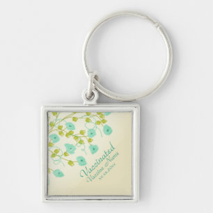Vaccinated notification with teal flowered key ring