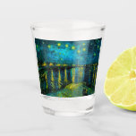 Van Gogh Starry Night Over the Rhône  Shot Glass<br><div class="desc">Shot Glass featuring Vincent van Gogh’s oil painting Starry Night Over the Rhône (1888). Shining yellow stars decorate the blue night sky as a couple strolls along a riverbank in Arles. A perfect gift for fans of Post-Impressionism and Dutch art.</div>