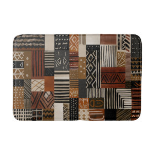 Variations of African motifs in earth tones Bath Mat