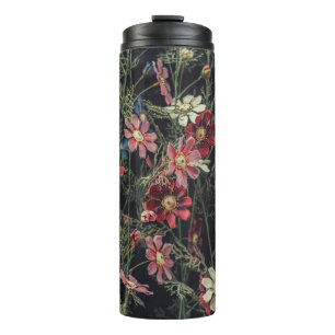 Various flowers on the black wooden background. Ab Thermal Tumbler