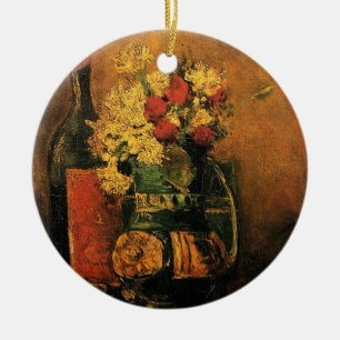 vase with carnations and roses and a bottle ceramic tree decoration