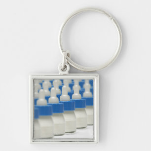 Very small feeding bottles in perspective, shot key ring