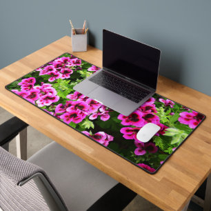 "Vibrant Blooms: Hot Pink Geraniums on Lush Bush Desk Mat