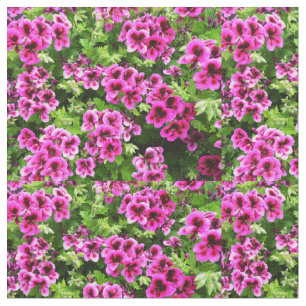 "Vibrant Blooms: Hot Pink Geraniums on Lush Bush Fabric