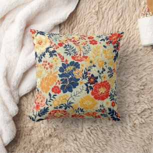 Vibrant flora red, yellow and blue on white cushion
