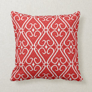 Vibrant ikat pattern in red and gold cushion
