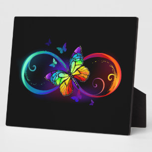 Vibrant infinity with rainbow butterfly on black plaque