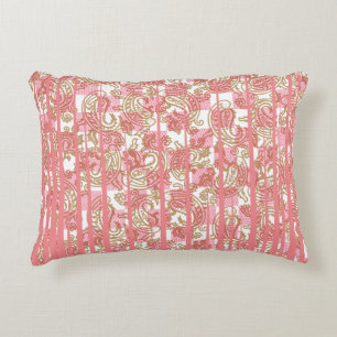 Vibrant pink fabric featuring intricate floral pat decorative cushion