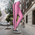 Vibrant Pink Leggings with Black Side Stripe<br><div class="desc">Add a pop of colour to your activewear with these bold pink leggings, featuring a sleek black side stripe for a striking contrast. Designed to make a statement both in and out of the gym, these leggings combine fashion-forward style with ultimate comfort. The high-waisted fit provides support and a flattering...</div>