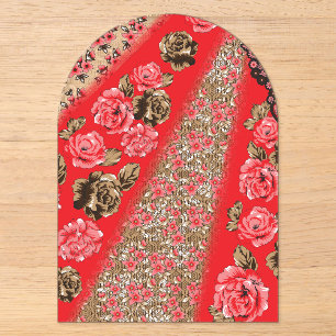 Vibrant red fabric featuring intricate floral and acrylic invitations