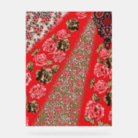 Vibrant red fabric featuring intricate floral and 