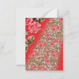 Vibrant red fabric featuring intricate floral and  card