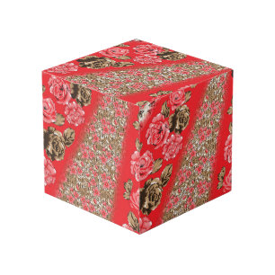 Vibrant red fabric featuring intricate floral and  cube