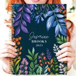 Vibrant Tropical Floral Custom Name Planner<br><div class="desc">This vibrant design showcases a lush tropical floral arrangement with colourful foliage and berries in shades of purple, orange, green, and blue, set against a deep navy background. The personalised name and year add a stylish and unique touch, making it perfect for nature lovers, students, or professionals. Ideal for organising...</div>