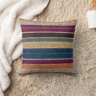 Vibrant woven stripes in warm colours cushion