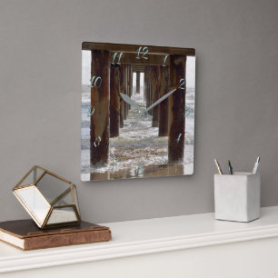 View from under fishing pier square wall clock