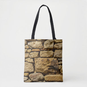 View of an old wall with yellow stonesabstract, ag tote bag