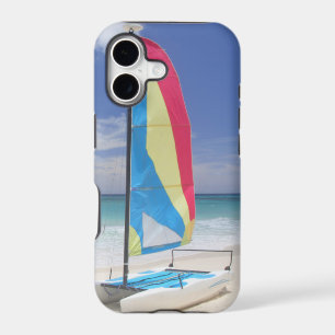 View Of Beach With Sailboat