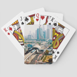 View of city metro line and skyscrapers playing cards