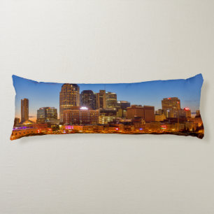 View of the city skyline at dusk body cushion