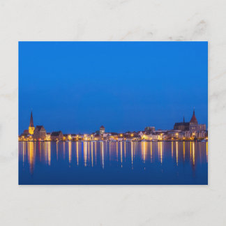 View to the city Rostock in Germany at night Postcard
