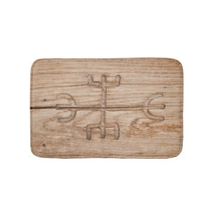 Viking rune on cracked wood bath mat