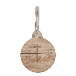 Viking rune on cracked wood pet tag