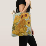 Vincent van Gogh's Stilleben Sunflowers Tote Bag<br><div class="desc">1888. Stilleben mit 12 Sonnenblumen or Vase with 12 sunflowers. Vincent Willem van Gogh was a post-Impressionist painter of Dutch origin whose work—noteable for its rough beauty,  emotional honesty,  and bold colour—had a far-reaching influence on 20th-century art.</div>